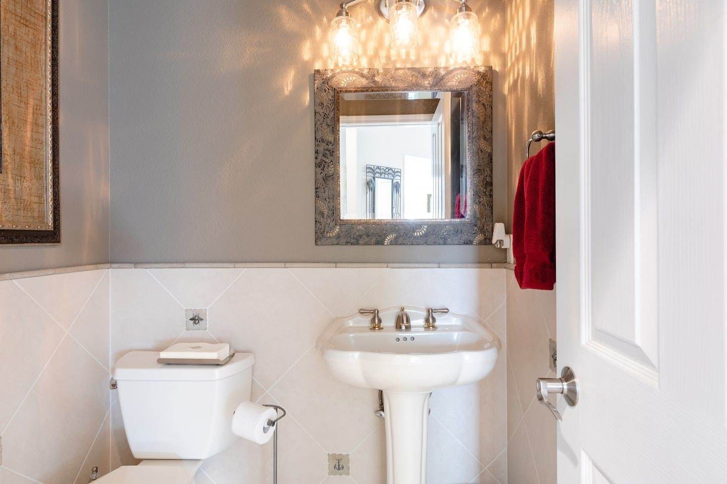 Powder room with a pedestal sink